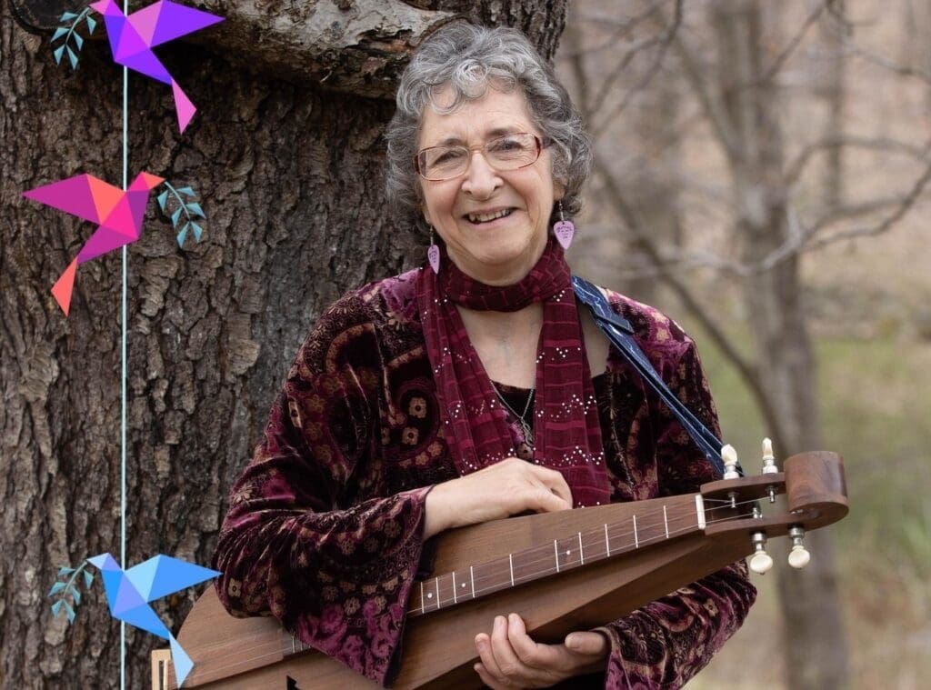 Deb Cavanaugh holding an instrument